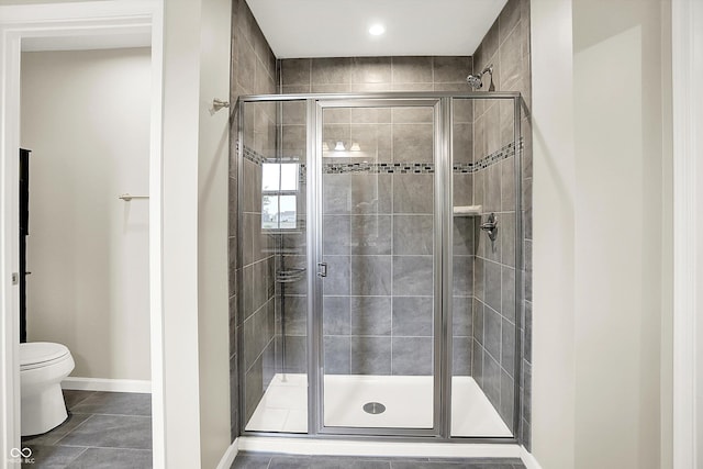 13567 Moorcroft Dr, Fishers, IN 46037 - full bathroom with toilet, a stall shower, baseboards, and tile patterned floors
