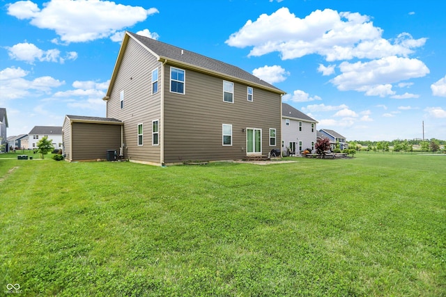 13567 Moorcroft Dr, Fishers, IN 46037 - rear view of house featuring a yard and central AC unit