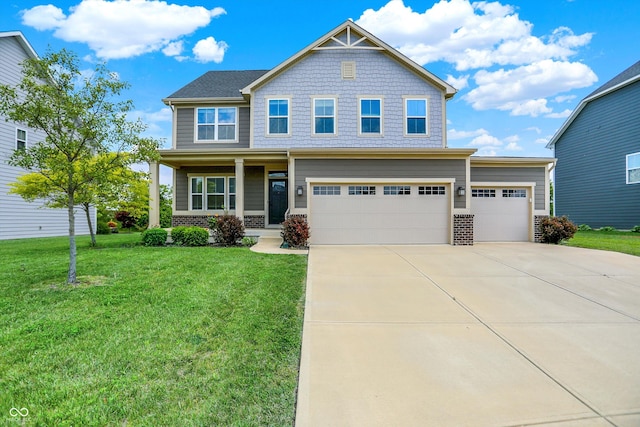 13567 Moorcroft Dr, Fishers, IN 46037 - craftsman-style home with driveway, a front yard, a porch, brick siding, and an attached garage
