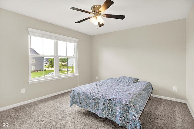 13567 Moorcroft Dr, Fishers, IN 46037 - bedroom with carpet floors, baseboards, and ceiling fan