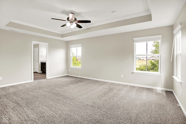 13567 Moorcroft Dr, Fishers, IN 46037 - carpeted empty room featuring a tray ceiling, ceiling fan, baseboards, crown molding, and a smoke detector