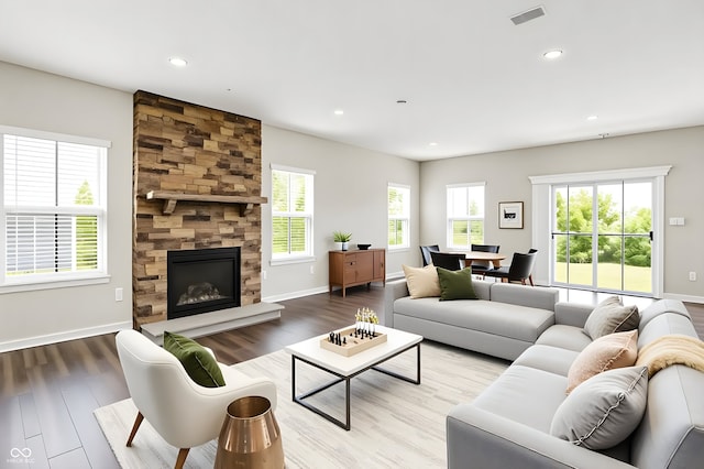 13567 Moorcroft Dr, Fishers, IN 46037 - living area with wood finished floors, a tile fireplace, baseboards, and recessed lighting