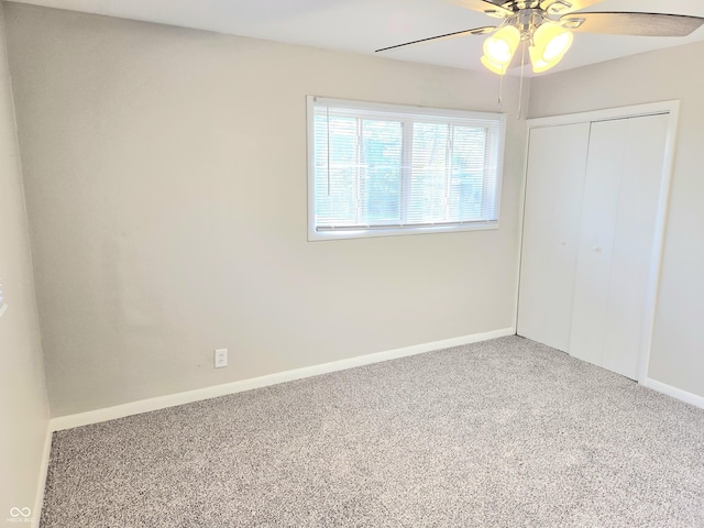 2465 N Eaton Ave, Indianapolis, IN 46219 - unfurnished bedroom featuring carpet floors, baseboards, a closet, and ceiling fan
