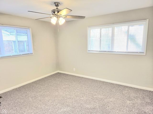 2465 N Eaton Ave, Indianapolis, IN 46219 - carpeted spare room with ceiling fan, healthy amount of natural light, and baseboards