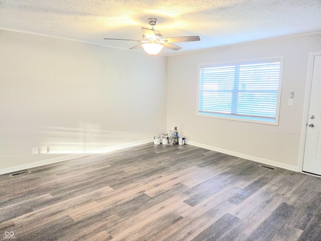 2465 N Eaton Ave, Indianapolis, IN 46219 - empty room with a ceiling fan, a textured ceiling, wood finished floors, baseboards, and crown molding