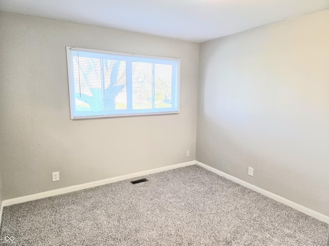 2465 N Eaton Ave, Indianapolis, IN 46219 - carpeted empty room with baseboards