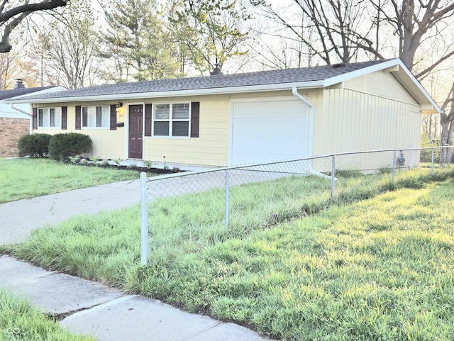 2465 N Eaton Ave, Indianapolis, IN 46219 - view of front of home featuring driveway, an attached garage, and a shingled roof