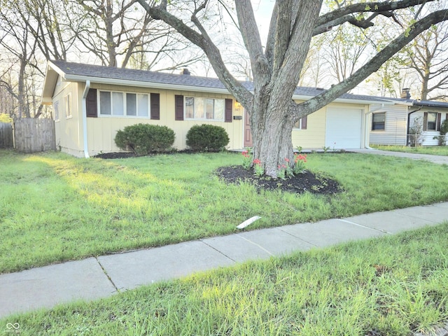 2465 N Eaton Ave, Indianapolis, IN 46219 - ranch-style home featuring an attached garage and board and batten siding