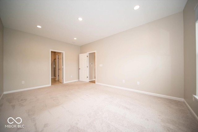 9455 Orchard Cove Dr, Indianapolis, IN 46239 - unfurnished room featuring baseboards, recessed lighting, and light colored carpet