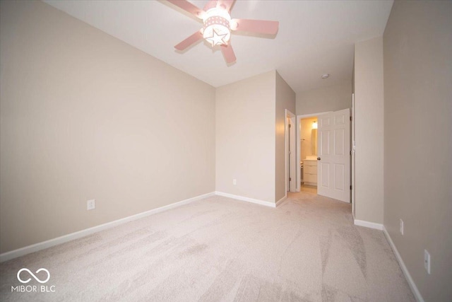 9455 Orchard Cove Dr, Indianapolis, IN 46239 - unfurnished bedroom featuring baseboards, light carpet, ceiling fan, and ensuite bath