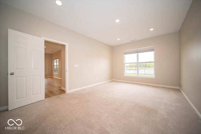 9455 Orchard Cove Dr, Indianapolis, IN 46239 - carpeted empty room with baseboards and recessed lighting