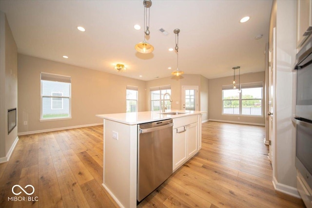 9455 Orchard Cove Dr, Indianapolis, IN 46239 - kitchen with a sink, light wood-style floors, open floor plan, and dishwasher