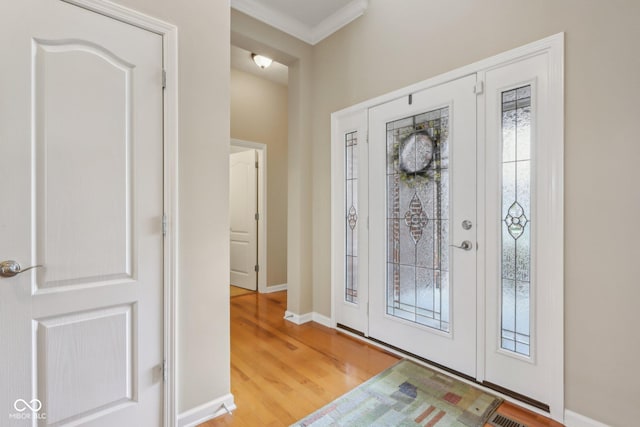 1361 Trescott Dr, Westfield, IN 46074 - entryway with wood finished floors, crown molding, healthy amount of natural light, and baseboards