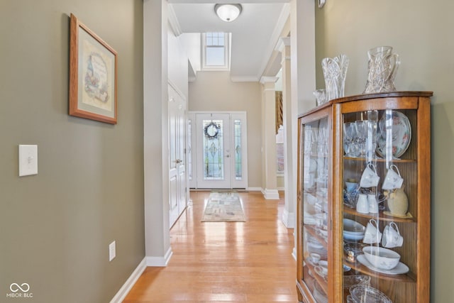 1361 Trescott Dr, Westfield, IN 46074 - hall with light wood-type flooring, baseboards, ornamental molding, and ornate columns
