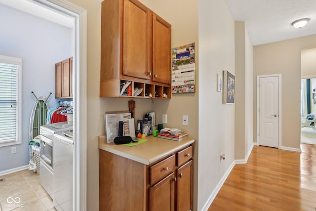 1361 Trescott Dr, Westfield, IN 46074 - corridor featuring washer and clothes dryer, baseboards, and light wood-type flooring