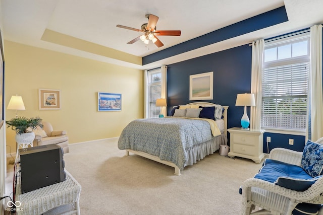 1361 Trescott Dr, Westfield, IN 46074 - bedroom with light colored carpet, baseboards, ceiling fan, and a tray ceiling