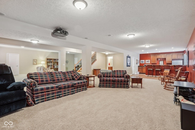 1361 Trescott Dr, Westfield, IN 46074 - living room featuring a textured ceiling, light carpet, stairway, and bar area