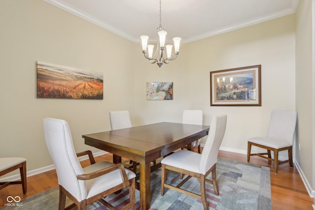 1361 Trescott Dr, Westfield, IN 46074 - dining room with light wood-style flooring, a chandelier, ornamental molding, and baseboards