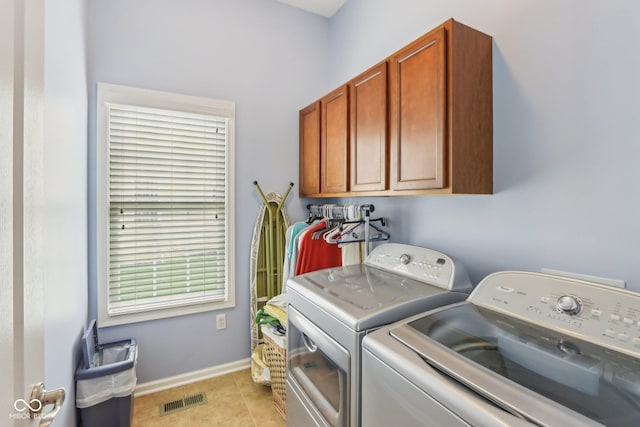 1361 Trescott Dr, Westfield, IN 46074 - clothes washing area with cabinet space, washer and dryer, baseboards, and light tile patterned flooring