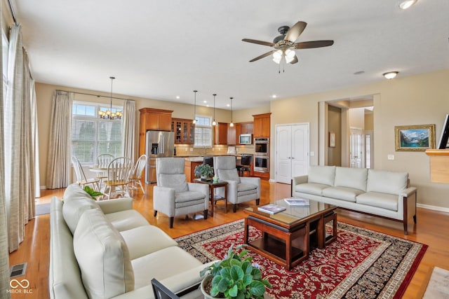 1361 Trescott Dr, Westfield, IN 46074 - living room featuring light wood-type flooring, plenty of natural light, ceiling fan, and recessed lighting