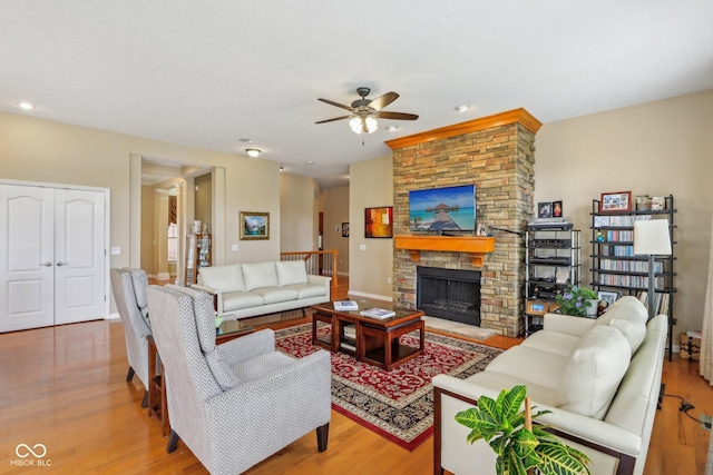 1361 Trescott Dr, Westfield, IN 46074 - living room with a ceiling fan, wood finished floors, a fireplace, and recessed lighting