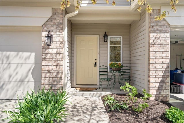 property entrance featuring stone siding and covered porch