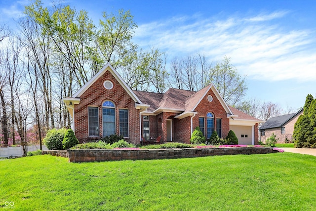 424 Orchard Blvd, Danville, IN 46122 - view of front of property featuring brick siding, an attached garage, and a front yard