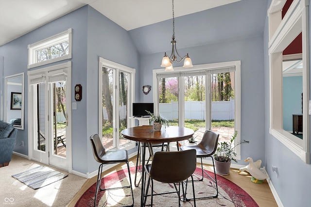 424 Orchard Blvd, Danville, IN 46122 - dining space featuring lofted ceiling, baseboards, and an inviting chandelier