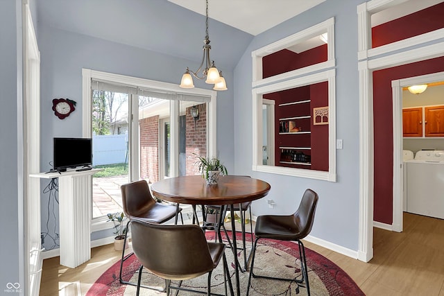 424 Orchard Blvd, Danville, IN 46122 - dining space featuring washer and dryer, vaulted ceiling, light wood finished floors, and baseboards