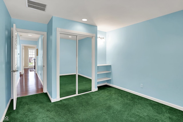 424 Orchard Blvd, Danville, IN 46122 - unfurnished bedroom with baseboards, carpet flooring, visible vents, and a closet