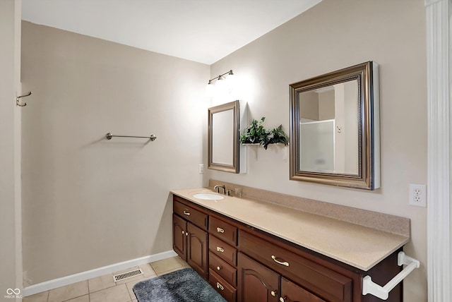 424 Orchard Blvd, Danville, IN 46122 - bathroom featuring baseboards, visible vents, tile patterned flooring, and vanity