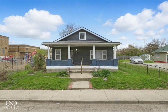 2349 Indianapolis Ave, Indianapolis, IN 46208 - view of front of house featuring fence, a front yard, and covered porch