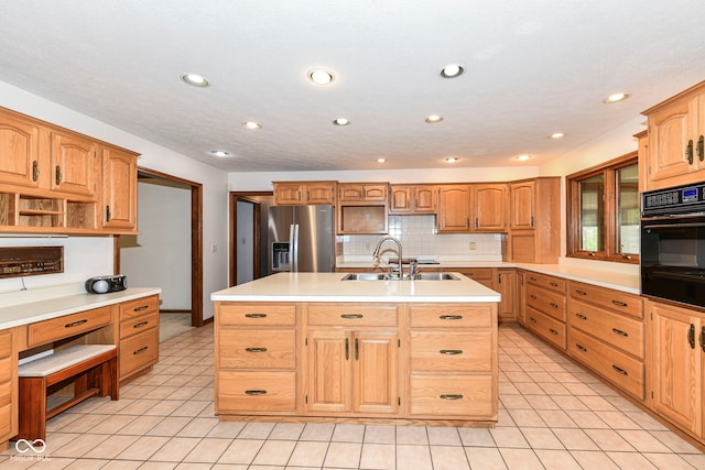kitchen with open shelves, a sink, oven, a center island with sink, and stainless steel fridge with ice dispenser
