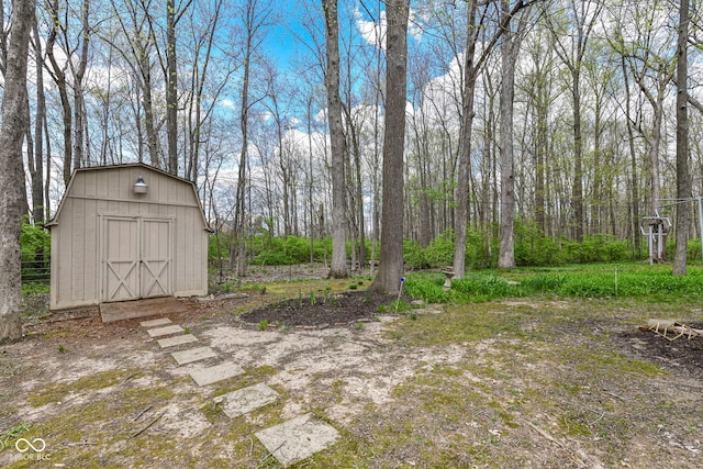 view of yard featuring a storage shed and an outdoor structure