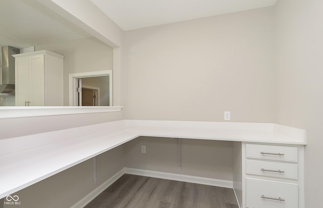 7215 Barrett Dr, Brownsburg, IN 46112 - unfurnished office featuring dark wood-style floors, baseboards, and built in study area