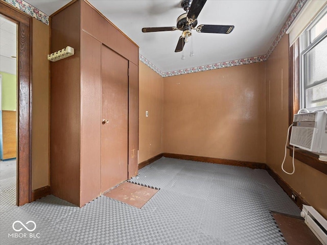 315 E N St, Greensburg, IN 47240 - unfurnished bedroom with a baseboard heating unit, light colored carpet, and a ceiling fan
