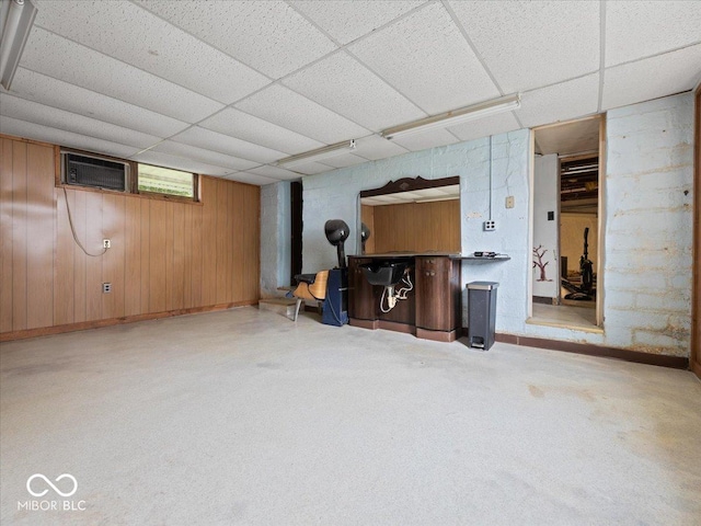 315 E N St, Greensburg, IN 47240 - basement with a paneled ceiling, a wall mounted air conditioner, and wood walls