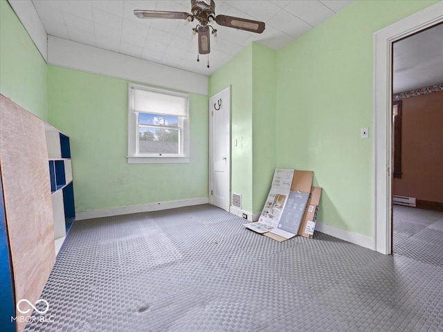315 E N St, Greensburg, IN 47240 - empty room with a ceiling fan, a baseboard heating unit, and carpet