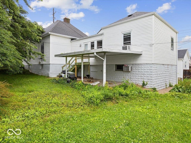 315 E N St, Greensburg, IN 47240 - rear view of house featuring a lawn