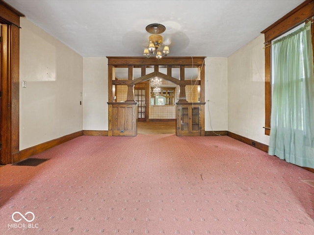 315 E N St, Greensburg, IN 47240 - unfurnished living room with a chandelier and carpet flooring