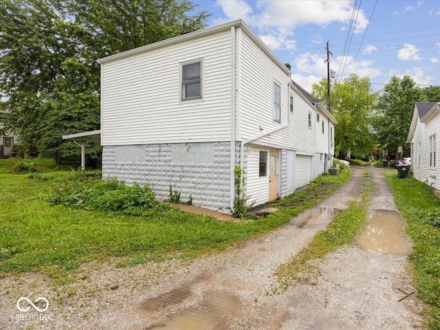 315 E N St, Greensburg, IN 47240 - view of side of property featuring driveway and a garage
