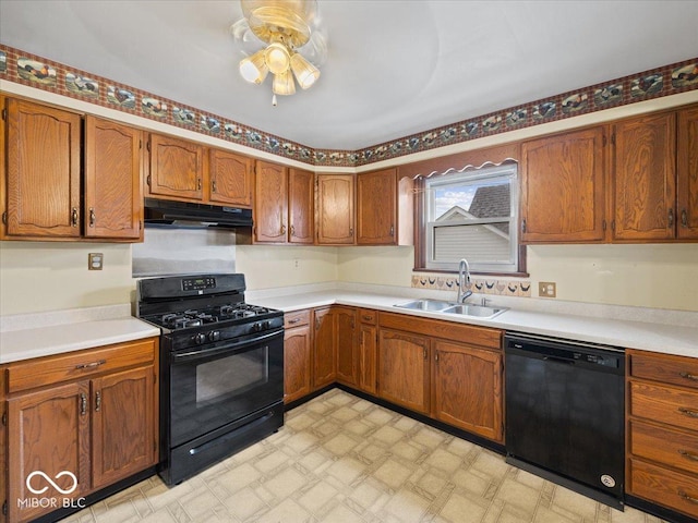 315 E N St, Greensburg, IN 47240 - kitchen with black appliances, under cabinet range hood, light floors, a ceiling fan, and light countertops