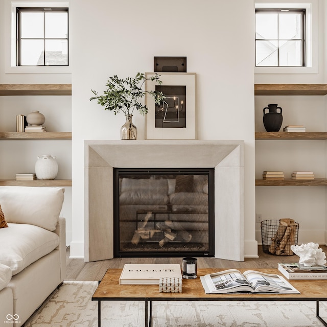 8082 Abington Way, Zionsville, IN 46077 - living area featuring a high end fireplace and wood finished floors