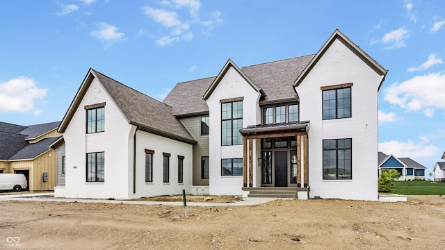 8082 Abington Way, Zionsville, IN 46077 - modern farmhouse featuring brick siding, roof with shingles, and a standing seam roof