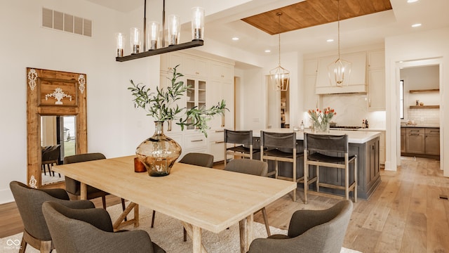 8082 Abington Way, Zionsville, IN 46077 - dining space with recessed lighting, a raised ceiling, visible vents, wooden ceiling, and light wood-style flooring