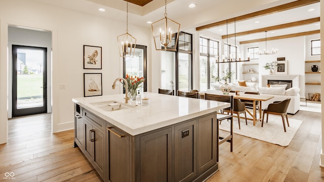 8082 Abington Way, Zionsville, IN 46077 - kitchen with an inviting chandelier, a healthy amount of sunlight, and a sink