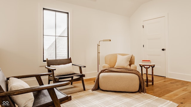 8082 Abington Way, Zionsville, IN 46077 - sitting room featuring baseboards, lofted ceiling, and light wood-type flooring