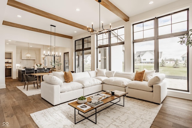 8082 Abington Way, Zionsville, IN 46077 - living area with beamed ceiling, wood finished floors, recessed lighting, and a chandelier