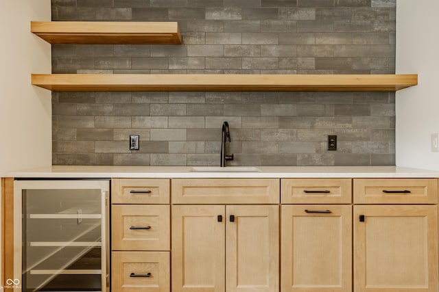 8082 Abington Way, Zionsville, IN 46077 - bar with decorative backsplash, beverage cooler, and a sink