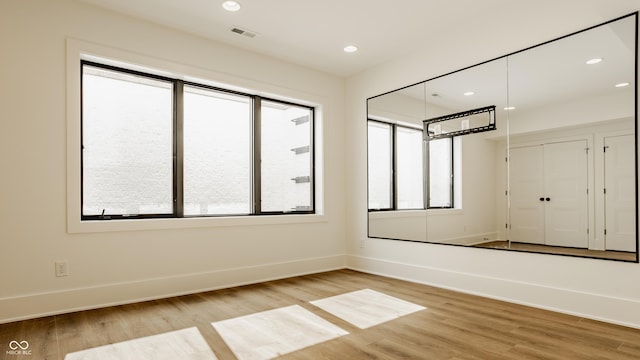 8082 Abington Way, Zionsville, IN 46077 - unfurnished bedroom featuring baseboards, visible vents, recessed lighting, and light wood-style floors